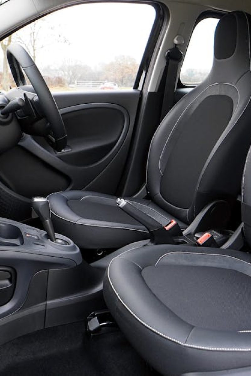 Clean interior of compact car with black seats