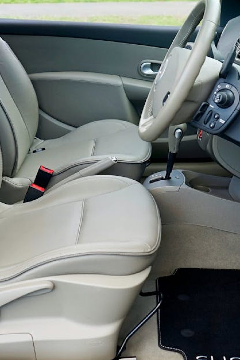 Explore the sleek interior of a Renault Clio, highlighting luxury car features and design.